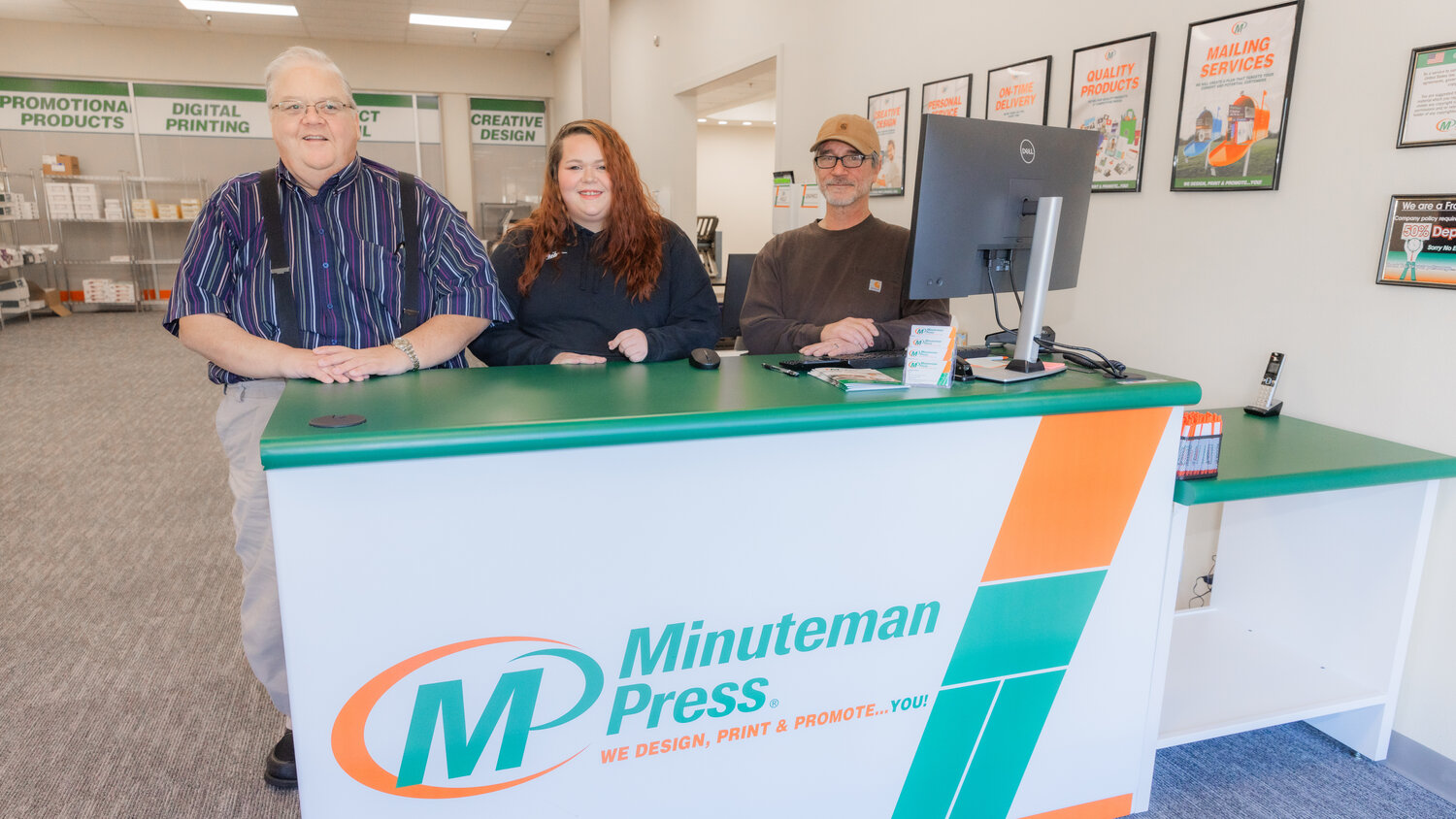 From left, Daryl Lund, Shakara Ryan and Robin Ronnell pose for a photo at Minuteman Press in Chehalis on Tuesday, Nov. 14.