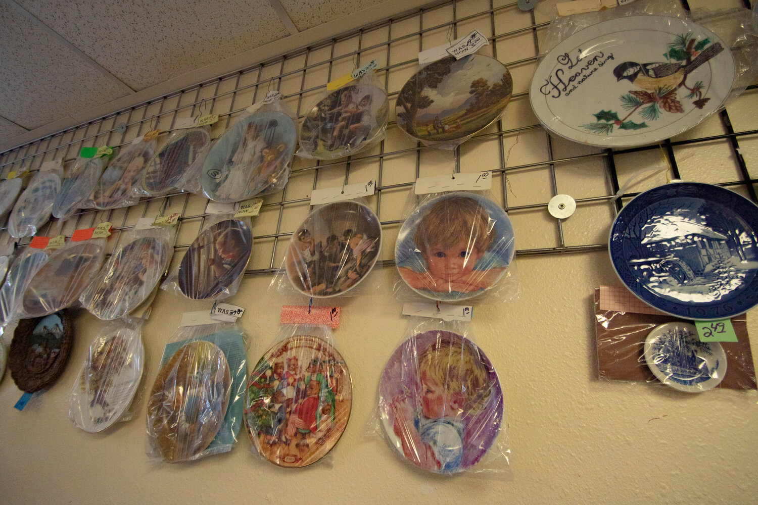 Collectible plates are seen hanging from the walls of Community Thrift in Centralia on Tuesday, Nov. 7.