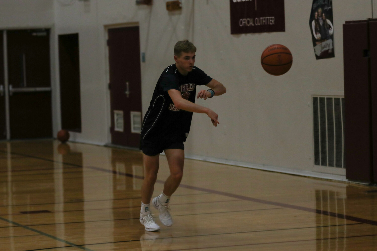 Brooks Ledgerwood dishes the ball to a teammate in a drill during W.F. West's practice on Nov. 21.