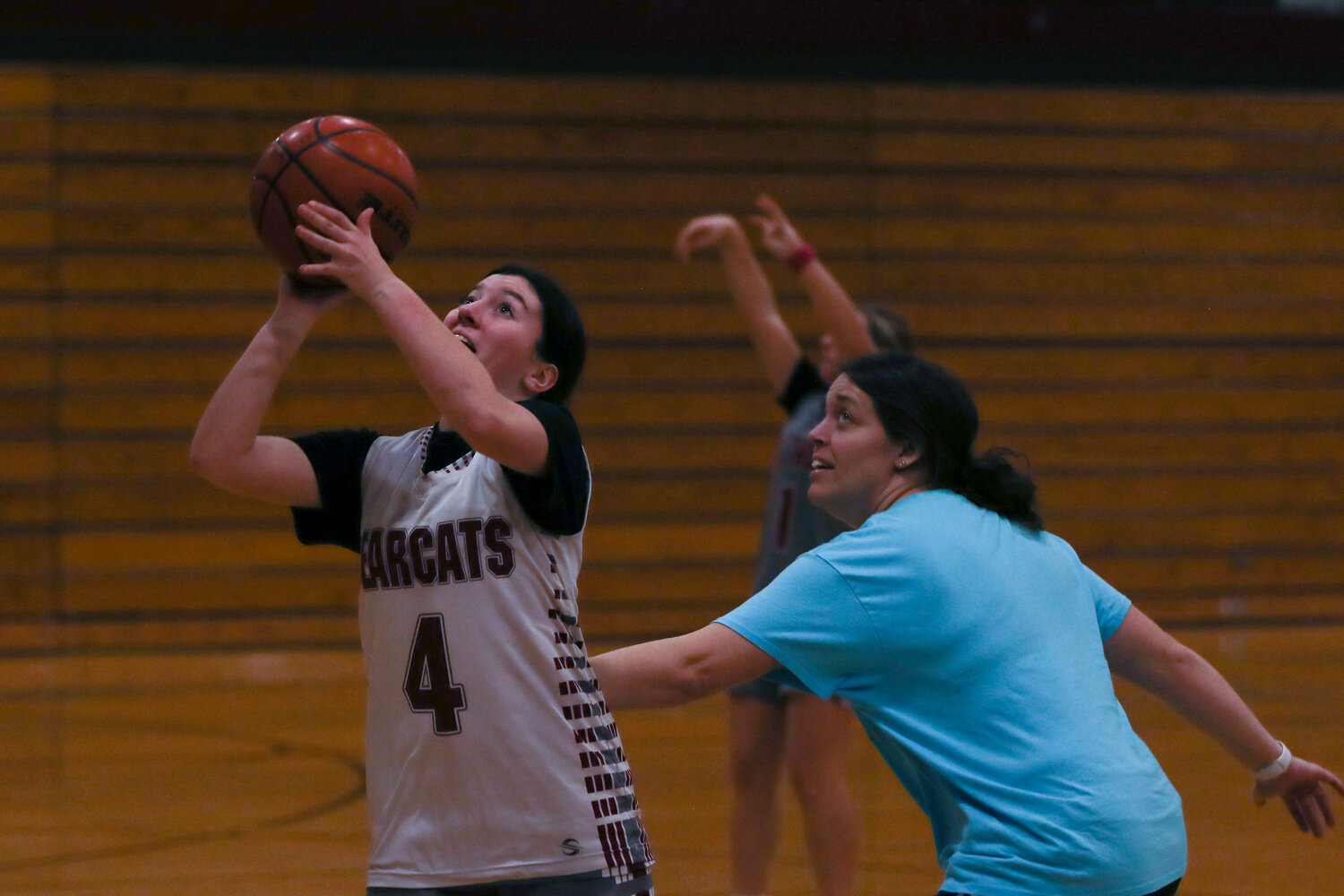 Ellie Clinton gets by assistant coach Caty Lieseke and puts up a shot during a drill in W.F. West's practice on Nov. 21.