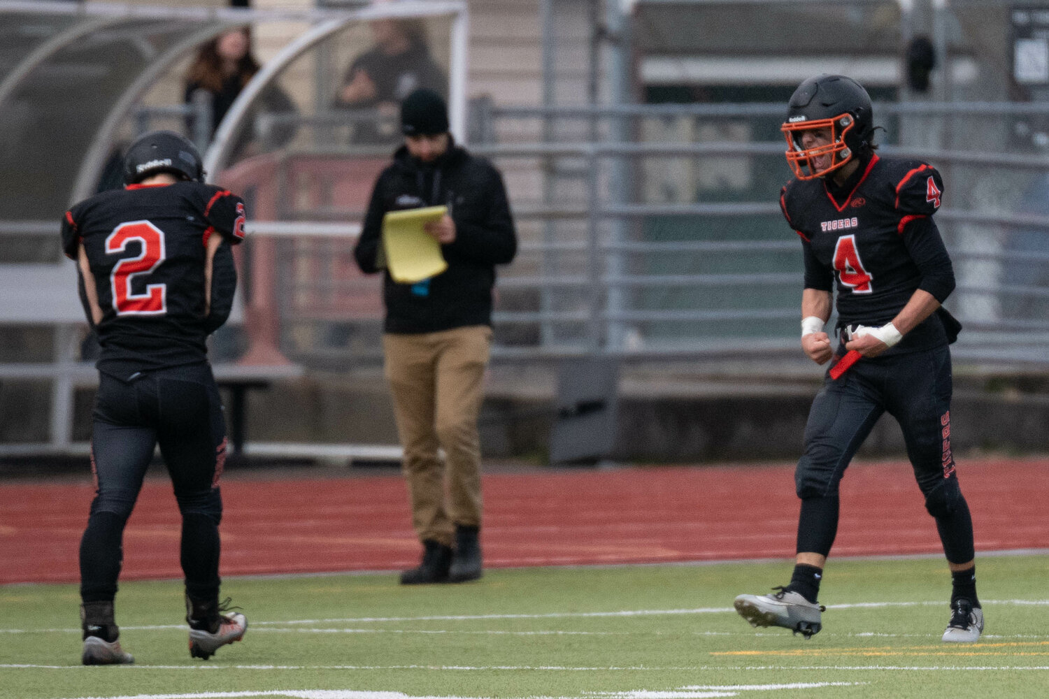 Ashton Demarest (4) celebrates with Cael Stanley after scoring a touchdown during Napavine's 36-26 win over Onalaska in the 2B semifinals at Tumwater District Stadium on Nov. 25.