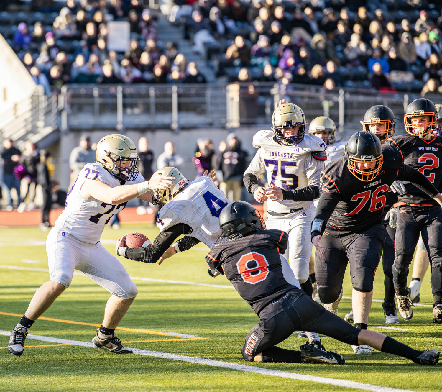 Onalaska’s Lane Sandell (77) reaches toward quarterback Kayden Mozingo (4) to pull him over the line into the end zone at the 2B state semifinals matchup against Napavine in Tumwater on Saturday.