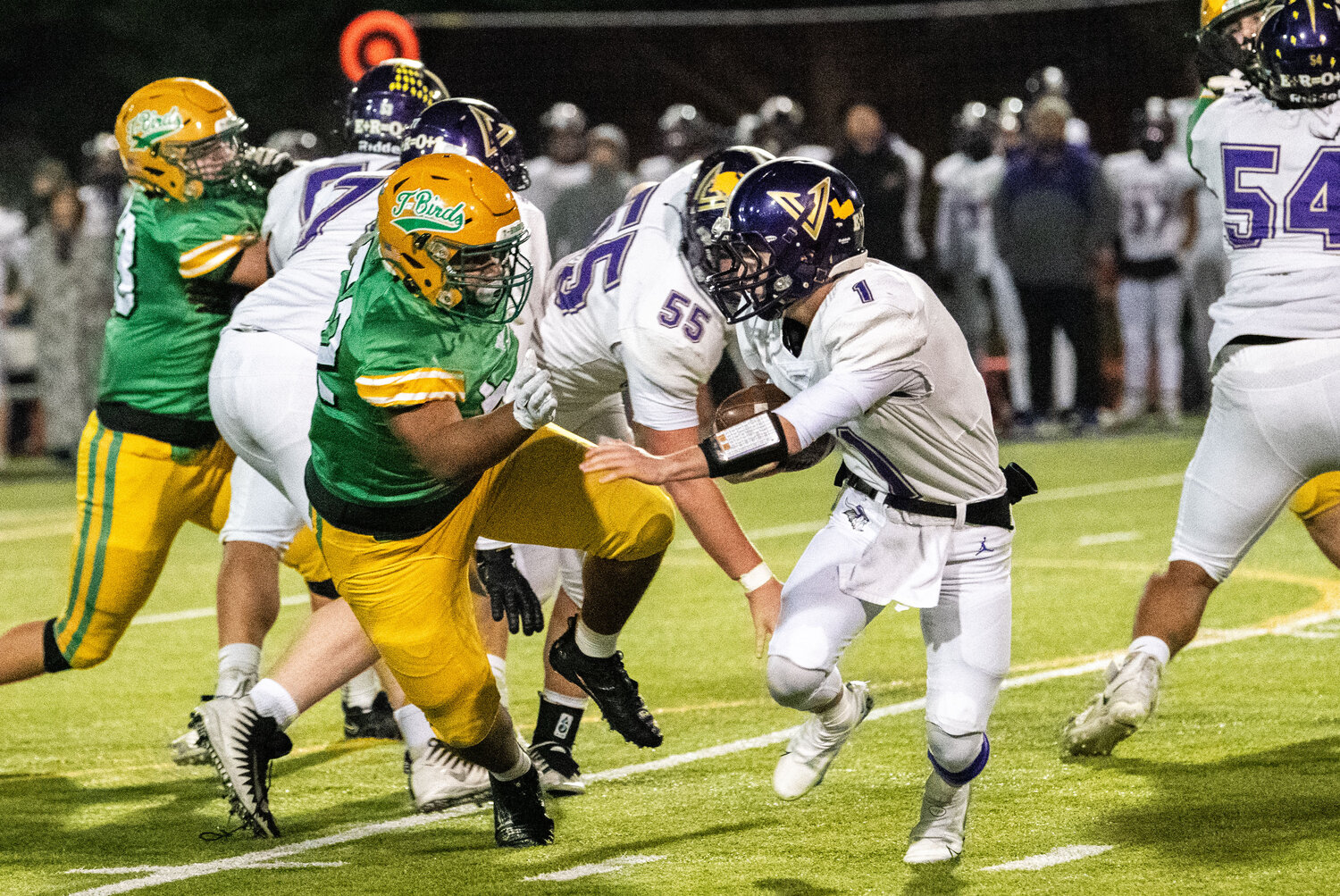 Tumwater’s Malijah Tucker faces off with North Kitsap’s Cole Edwards before a successful sack during a 2A state semifinal game on Saturday.