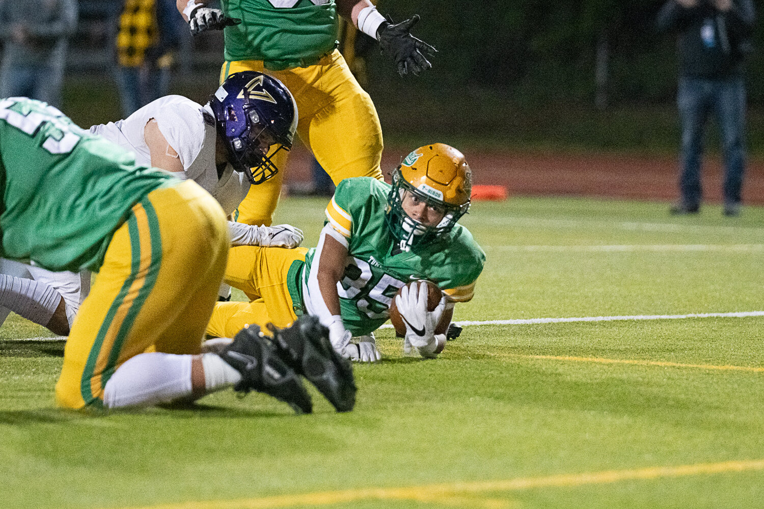 Kooper Clark dives over the goal line for his first touchdown of the night in Tumwater's 19-17 win over North Kitsap in the 2A state semifinals on Nov. 25.