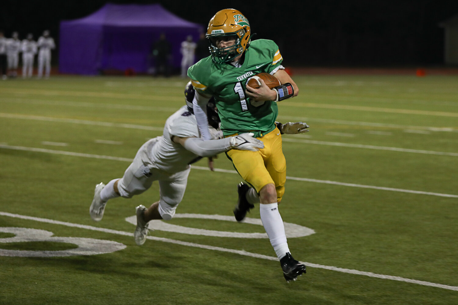 Tumwater's Ethan Kastner rushes downfield during a 19-17 win over North Kitsap Nov. 25.