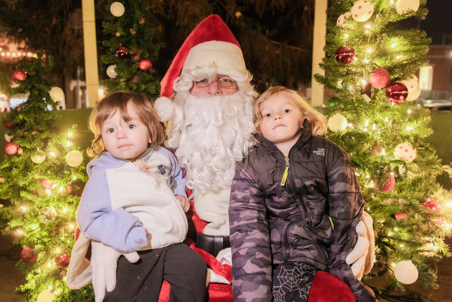 Jasper and Lucas Jordan pose for a photo with Santa at George Washington Park in Centralia during a tree lighting ceremony on Friday, Nov. 24.