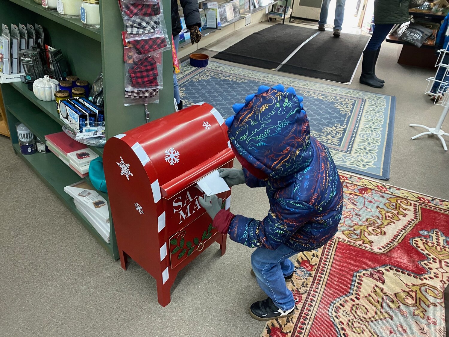 A letter to Santa is dropped in a mailbox in downtown Chehalis in this photo provided by Experience Chehalis.