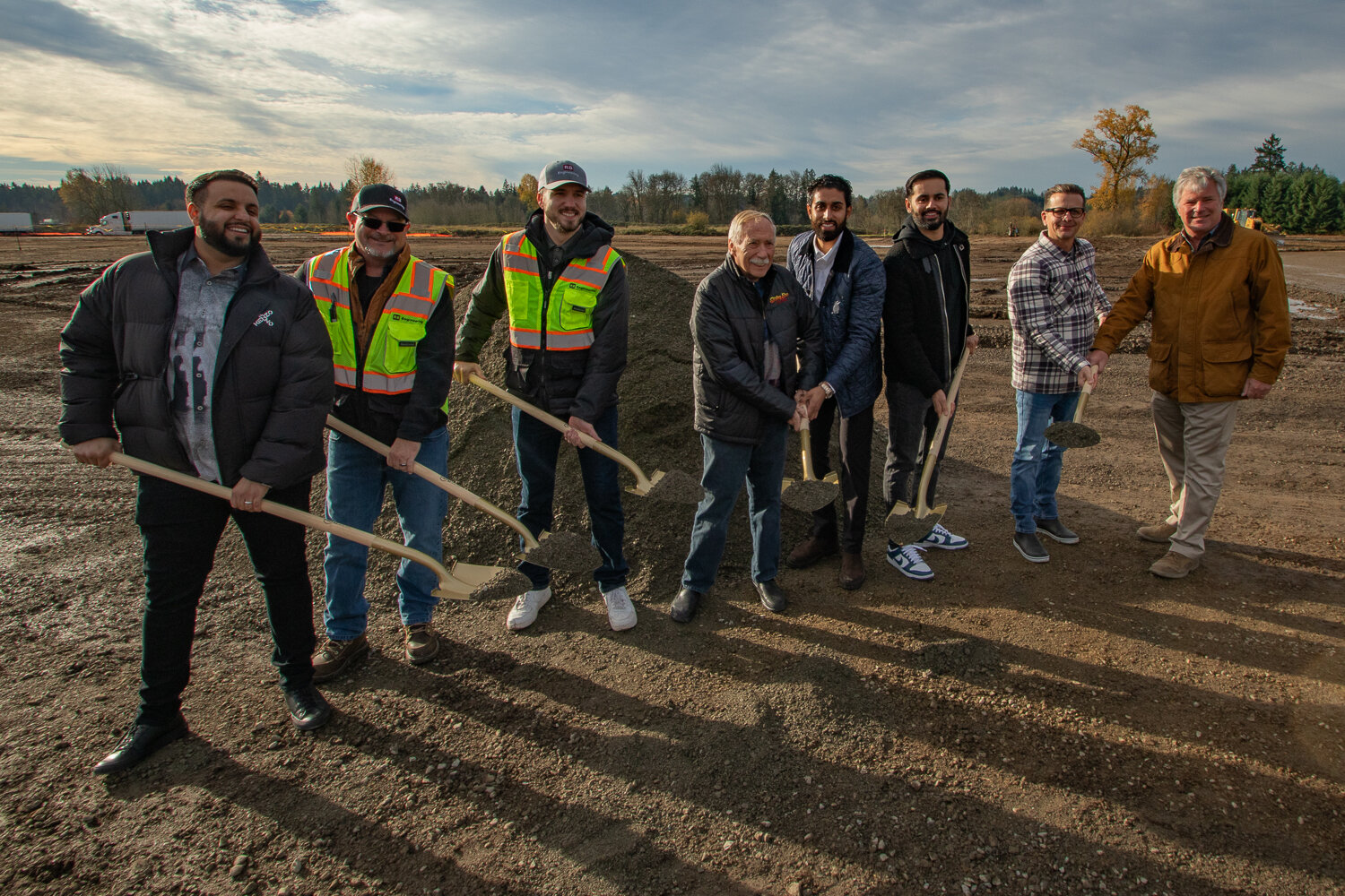 From the left, TA Napavine co-owner Damanjit Singh, Bob Balmelli and Zach Wirkkala of RB Engineering, Sterling Breen of Sterling Breen Crushing,TA Napavine co-owner Gurinderjit Sidhu, TA Napavine co-owner Manpreet Singh, Jake Iverson of Sterling Breen Crushing and Jim Mayer of Mountain Construction post for a ceremonial groundbreaking photo on Nov. 21 as construction on the new TA truck stop in Napavine has officially begun.
