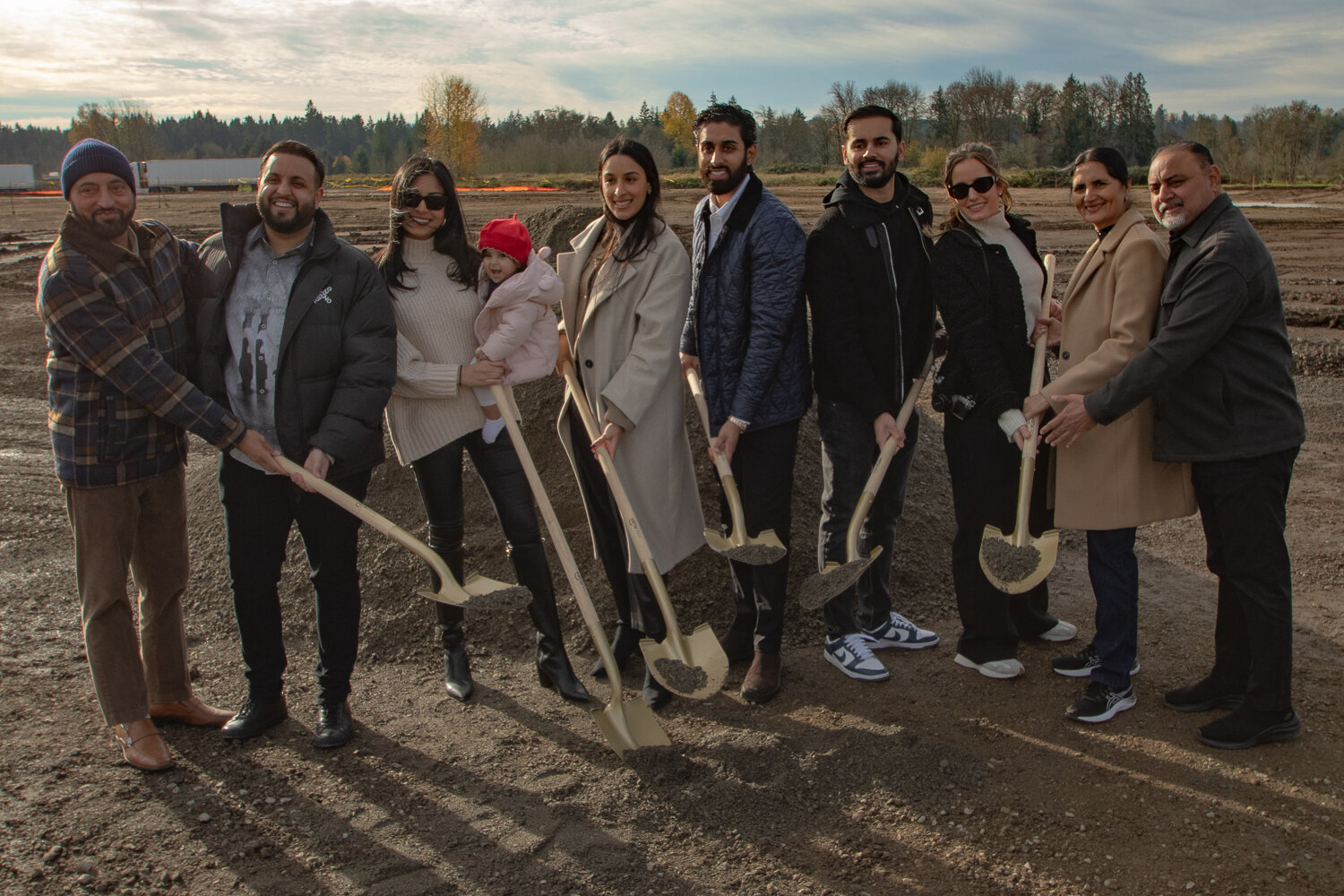 From the left, Inderjit Singh, TA Napavine co-owner Damanjit Singh, Manveer Sodhi, Syra Sodhi, Kamal Sidhu, TA Napavine co-owner Gurinderjit Sidhu, TA Napavine co-owner Manpreet Singh, Karina Multani, Satwinder Kaur and Sukhdeep Multani pose for a photo during a groundbreaking ceremony held on Tuesday, Nov. 21, for the new TA Napavine truck stop being constructed off of Exit 72 on Interstate 5.