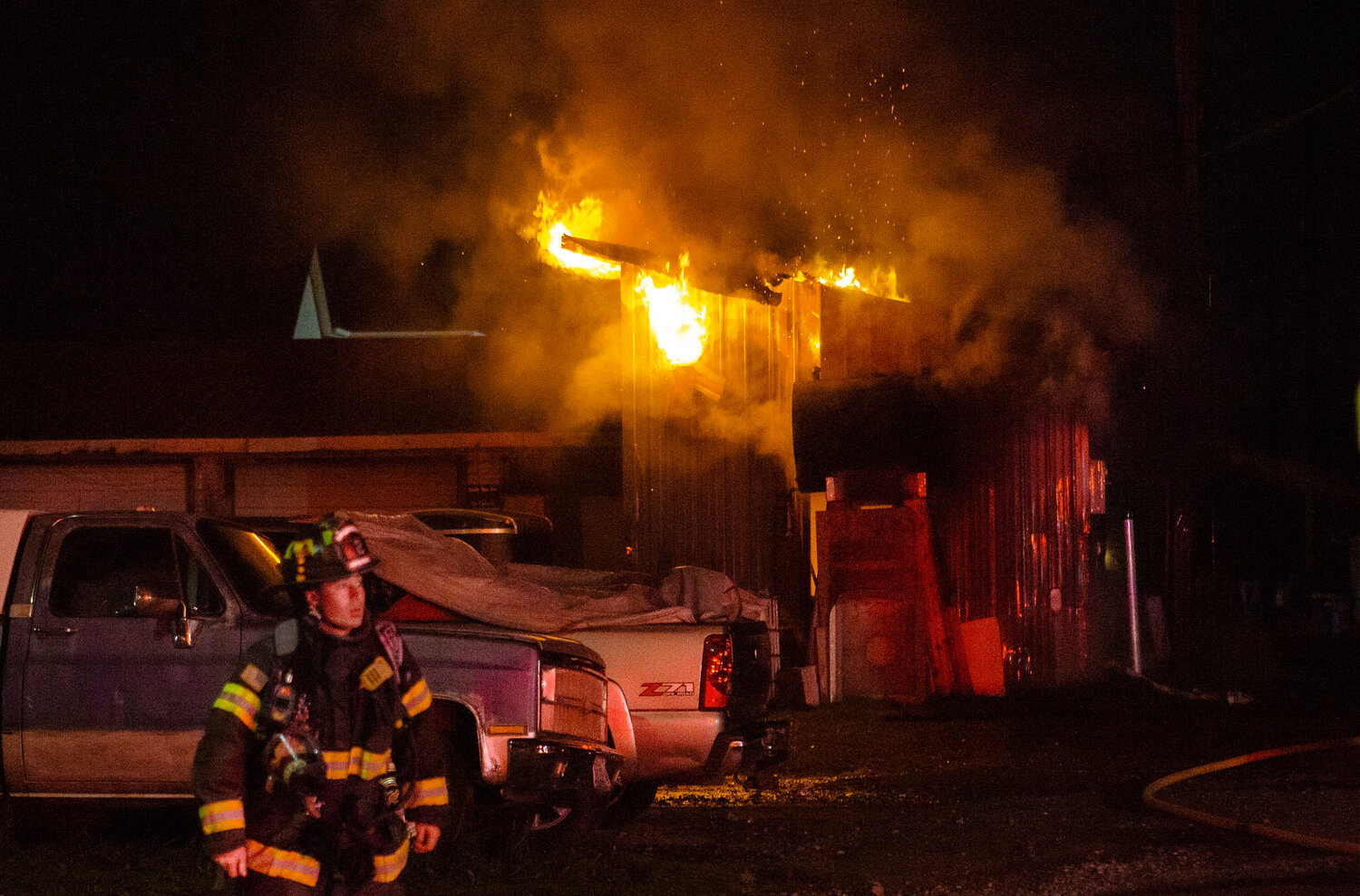 Riverside Fire Authority and Centralia Police respond to a burning outbuilding near the corners of North Pearl and Fourth Streets on Tuesday night, Nov. 21, at about 6:30 p.m.