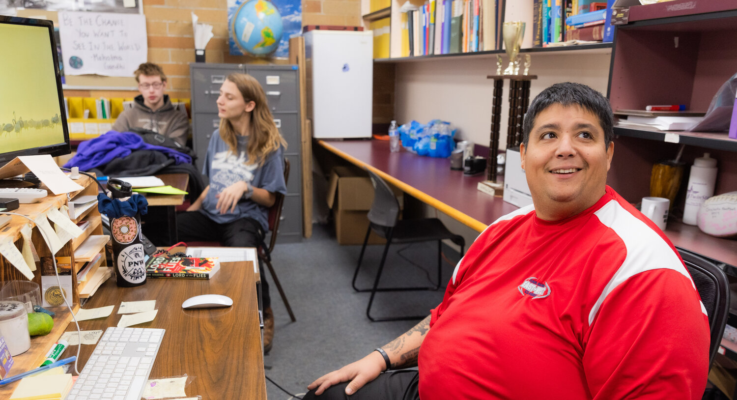 Mazen Saade, a history teacher, smiles while educating students at Onalaska High School on Tuesday, Nov. 28.