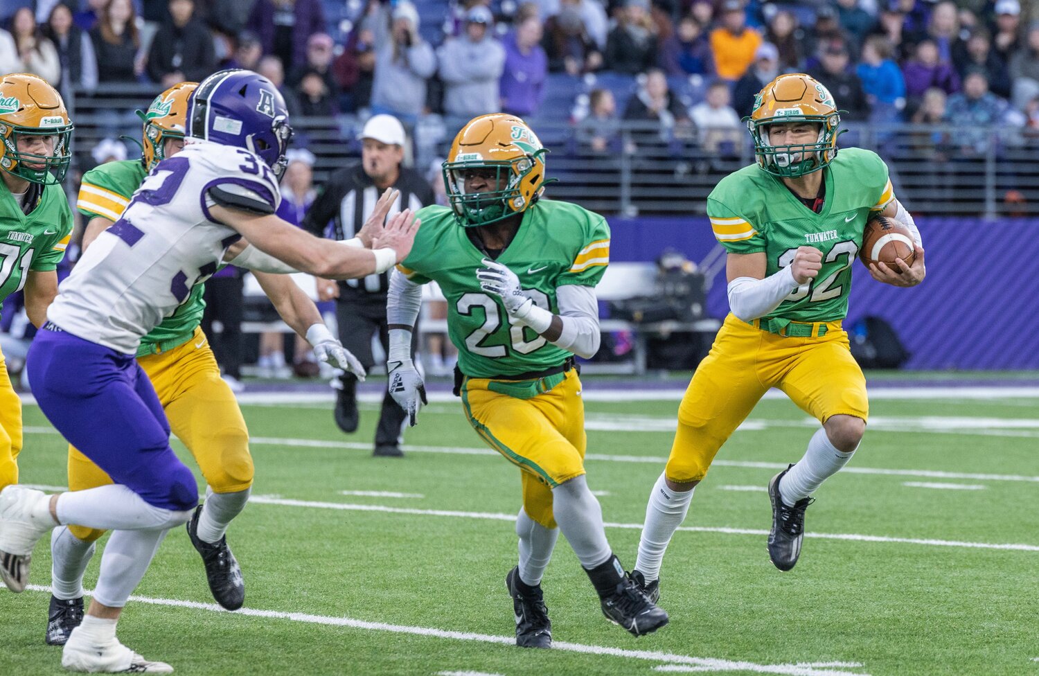 Peyton Davis runs behind Jaylin Nixon during the first half of Tumwater's loss to Anacortes in the 2A state championship game on Dec. 2 at Husky Stadium in Seattle.
