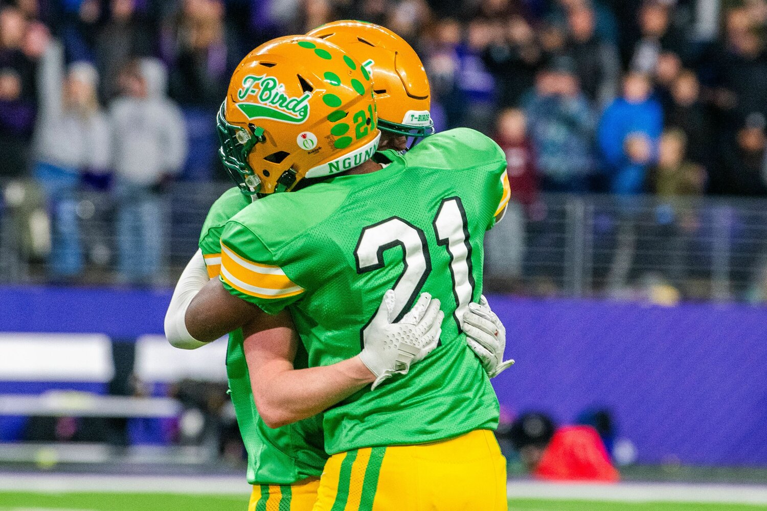 Tumwater’s David Malroy embraces his teammate after the Thunderbirds fell to the Anacortes Seahawks in the 2A State Championship game at Husky Stadium on Saturday, Dec. 2.