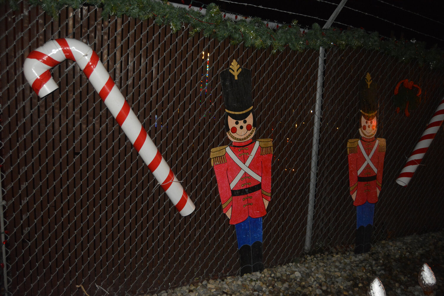 Candy canes and nutcrackers decorate a fence in Rainier's Holiday Park on Dec. 2.