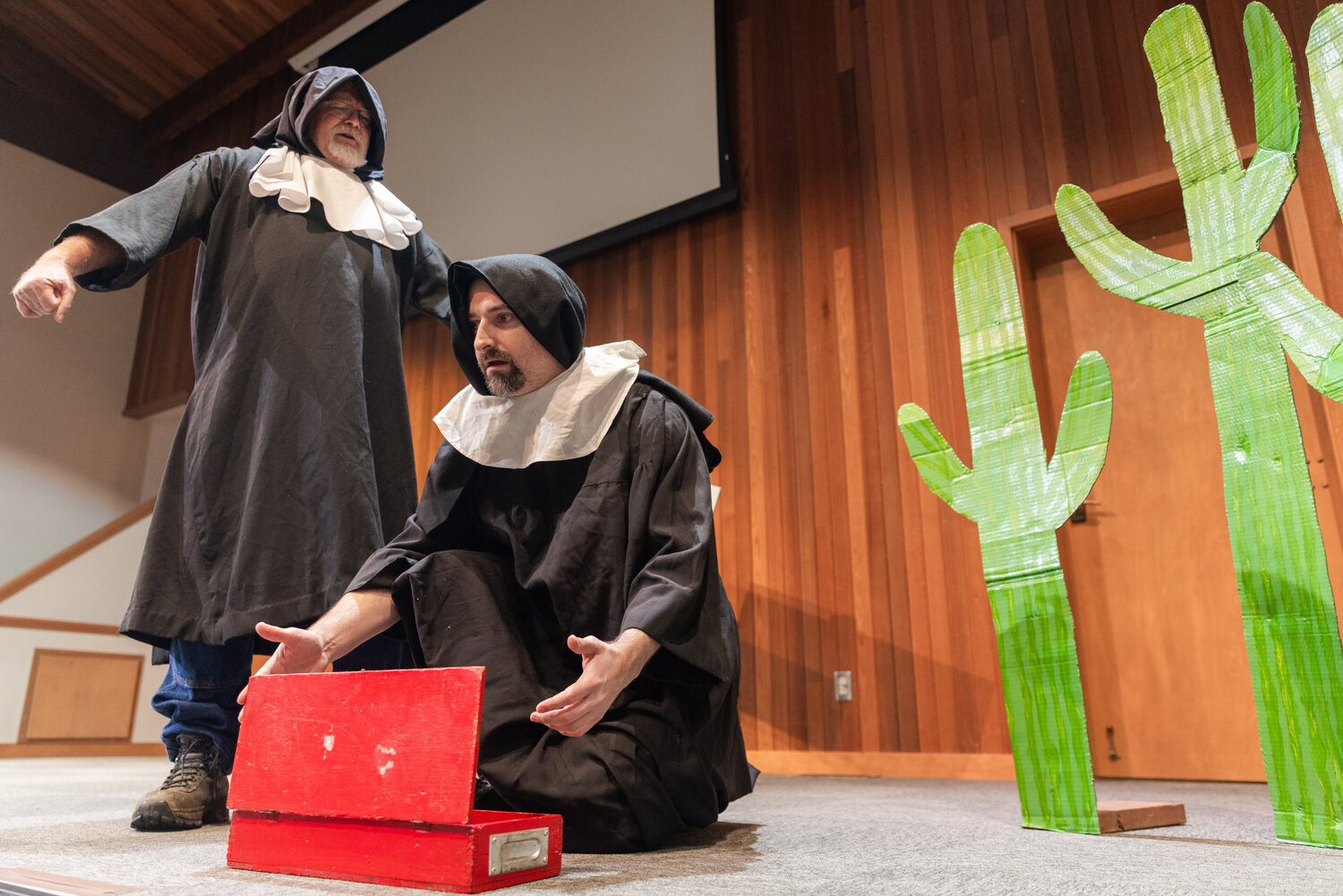 Randy Humphreys as Hector Bogonzoles and Alex Johnson as Jake Headley perform on stage during dress rehearsals for the Christmas at Rattlesnake Gulch play at Mountain View Baptist Church in Centralia.