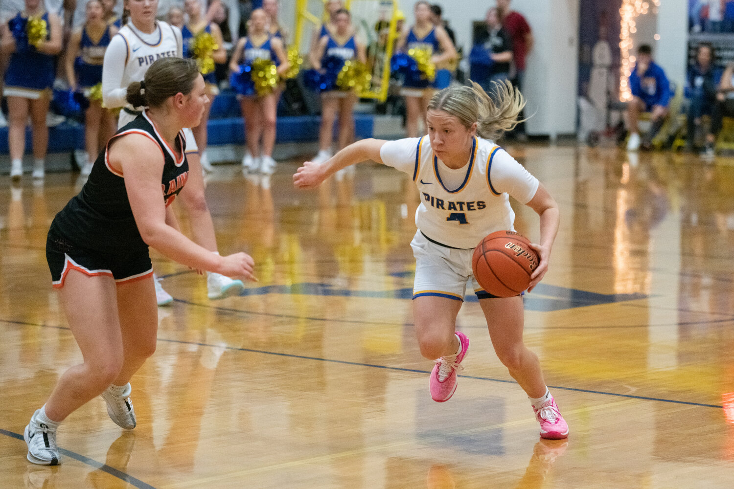 Karsyn Freeman tries to work around a defender during the first half of Adna's 52-49 loss to Rainier on Dec. 8.
