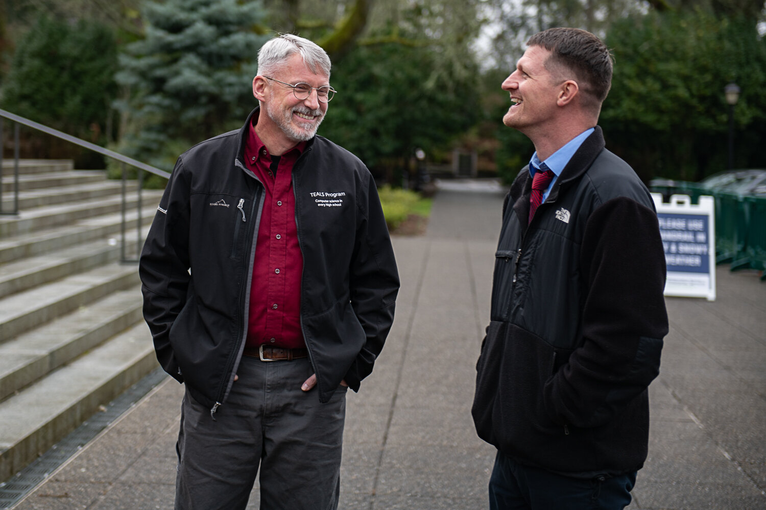 At right, state Rep. Joel McEntire, R-Cathlamet, smiles at a rally in Olympia held on the steps of the state legislative building on Jan. 31.