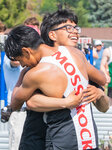 Mossyrock High School seniors Angel Velasco Ortiz and Christian Paz-Tapia hug after their relay team — with brothers Matt Cooper, a senior, and Luke Cooper, a junior — finish a heat on Friday, May 26 for the 1B boys 4x100 meter dash in Yakima for the State track and field meet.