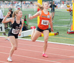 Napavine’s Morgan Hamilton throws herself over the finish line, taking second place by hairs of a second during the 2B girl 200 meter dash State finals in Yakima on Saturday, May 27.