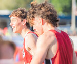 Toledo’s Trevin Gale smiles beside teammate John Rose after winning the championship in the 4x400m event at the 2B State championship track and field meet in Yakima on Saturday.
