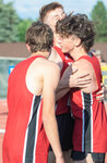 Toledo’s Trevin Gale and John Rose rush to Conner Olmstead for a hug after he completes the boys 4x400 meter relay and solidifies their State championship in Yakima on Saturday, May 27.